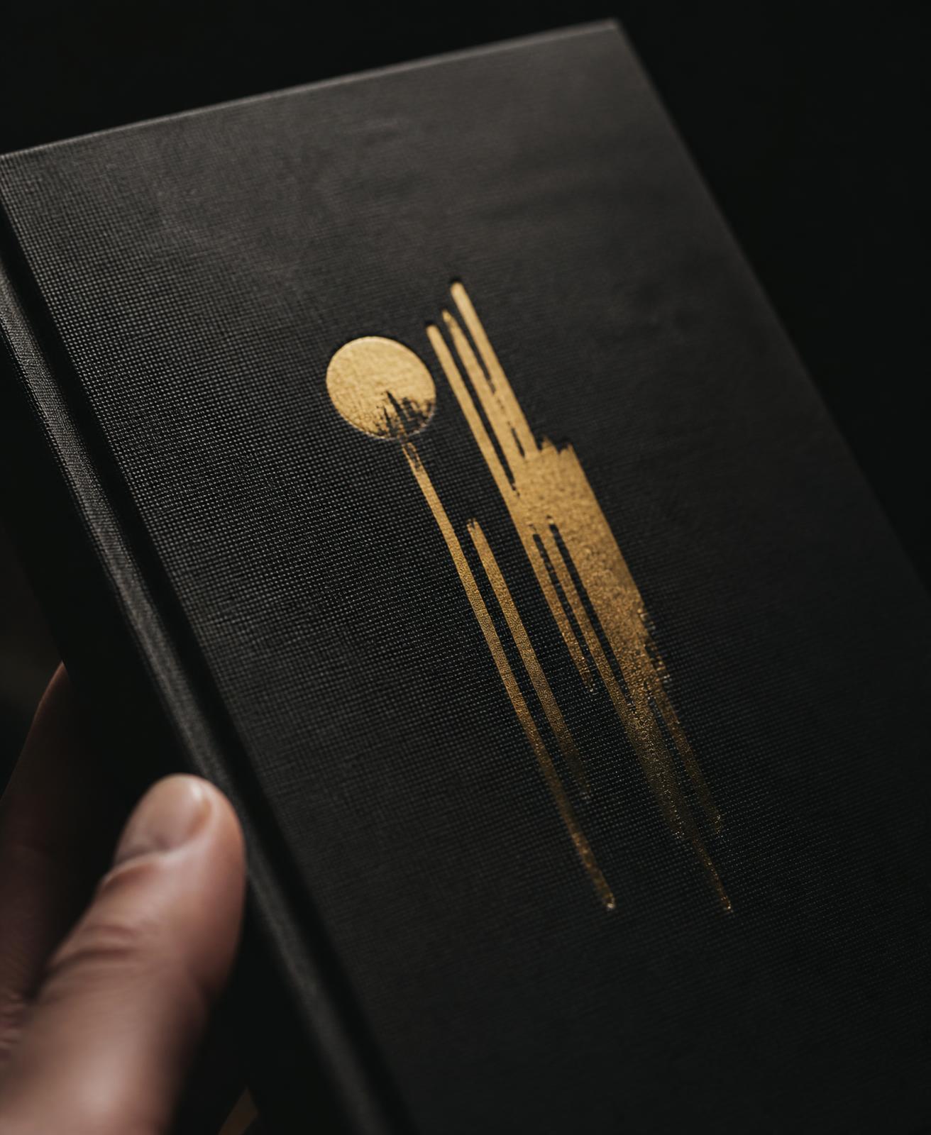 Black book cover with gold foil detail