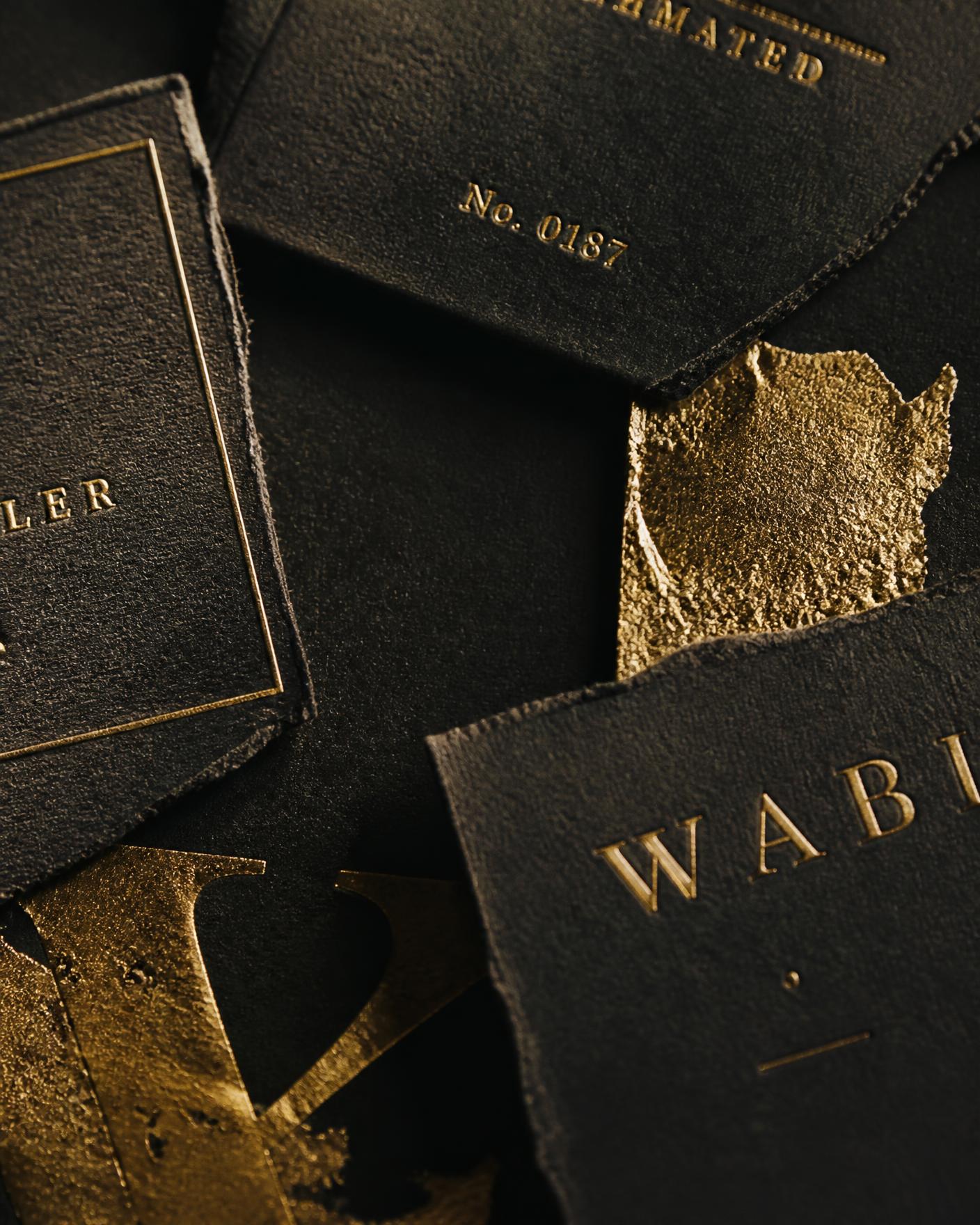 Black letterpress cards with gold foil detail